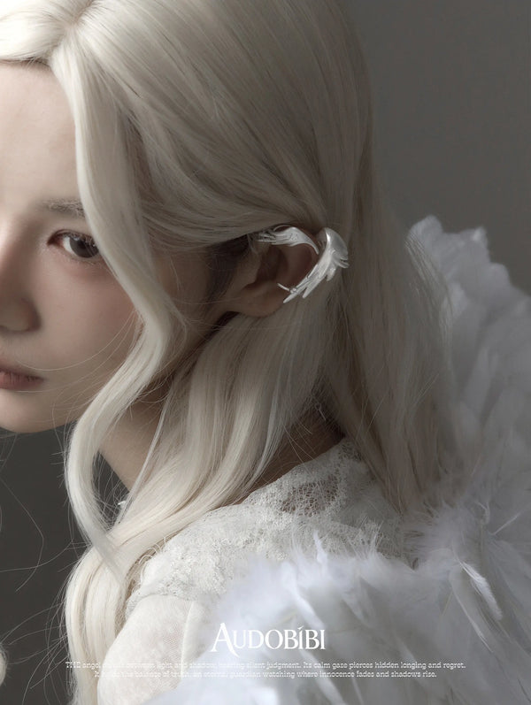 Winged Grace Judgment Angel Long Wing Ear Cuff, shown worn by a model.