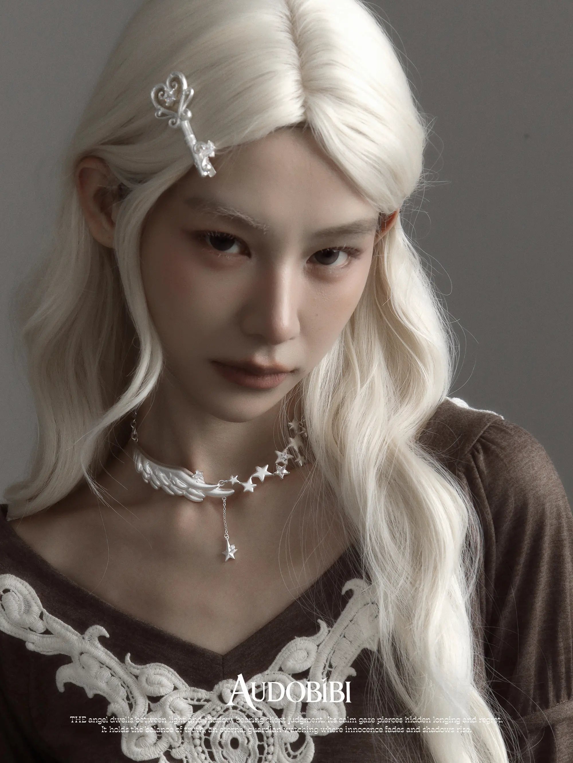 Winged Grace Starlit Angel Wing Pendant Necklace, shown worn by a model.