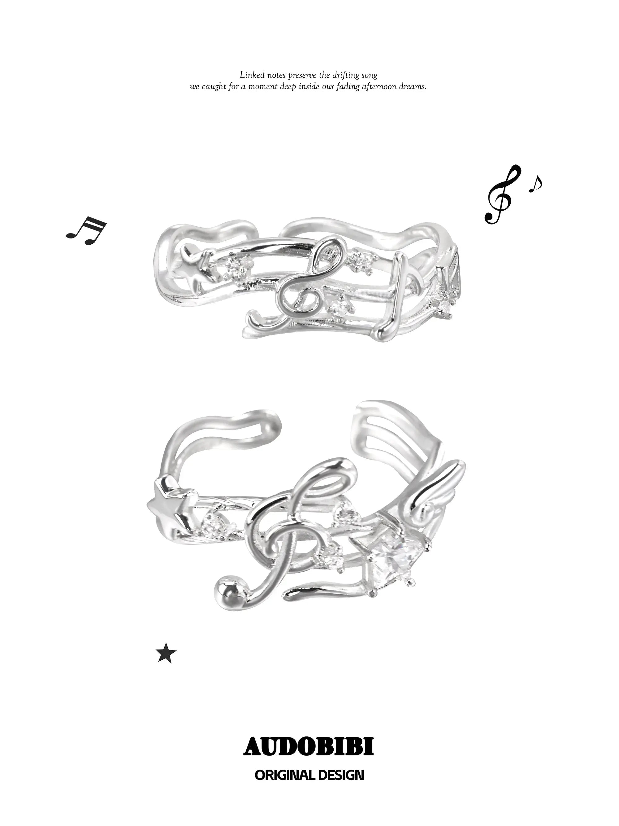 Two musical-note open-ring designs shown together.